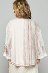 3/4 sleeve v-neck with patchwork detailing and contrast stitching