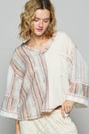 3/4 sleeve v-neck with patchwork detailing and contrast stitching