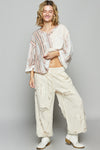 3/4 sleeve v-neck with patchwork detailing and contrast stitching