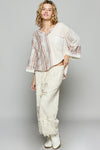 3/4 sleeve v-neck with patchwork detailing and contrast stitching