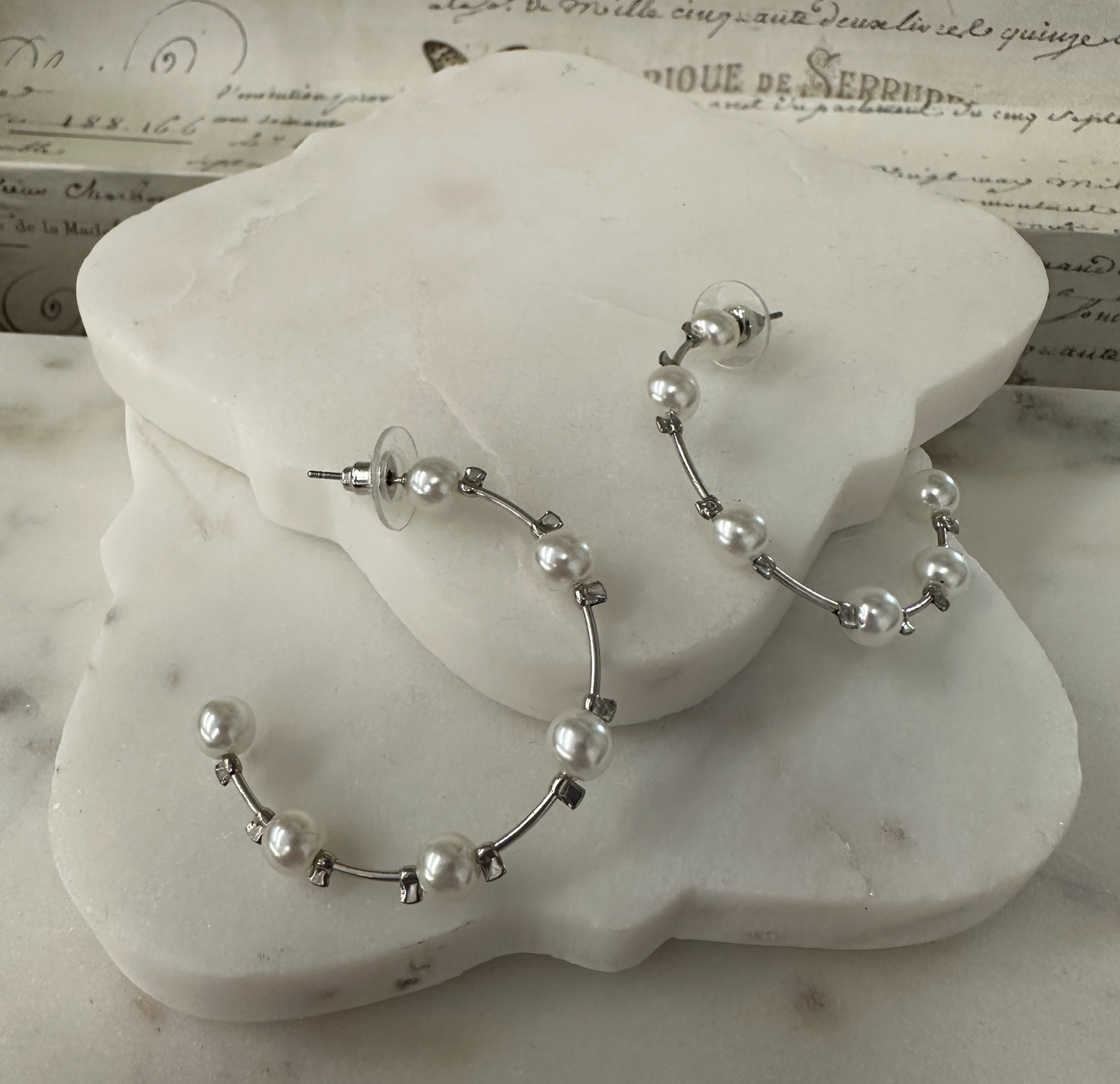 Its Sense wire pearl earrings Earrings Dallas Market Center