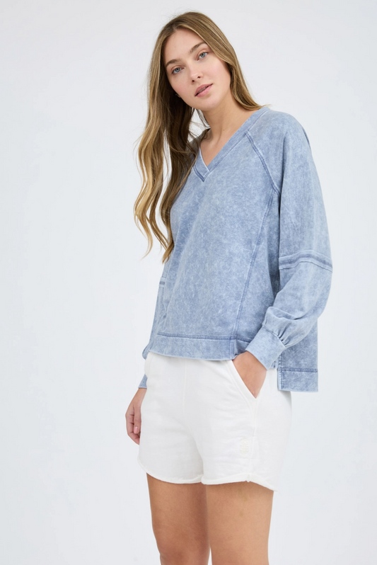 Washed v-neck exposed seam long sleeve knit top