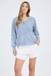 Washed v-neck exposed seam long sleeve knit top
