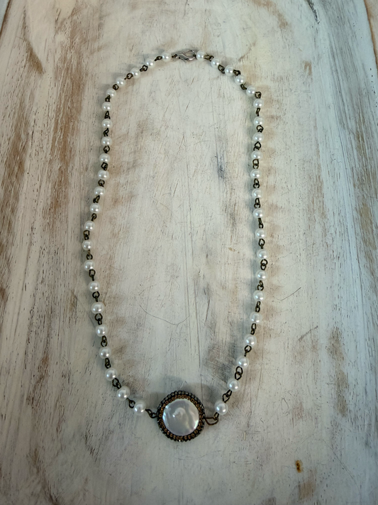Faux pearl necklace with mother-of-pearl cabochon