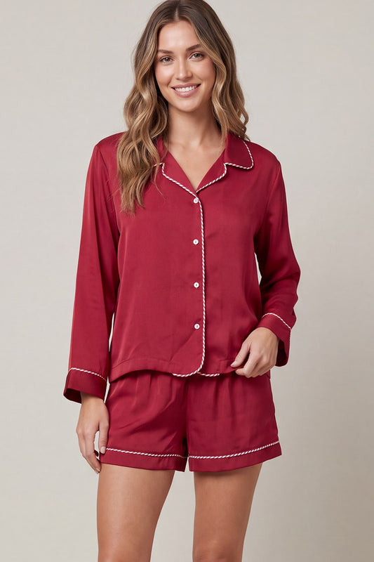 Woven satin long sleeve top and shorts pajama set with contrast piping detail and pockets