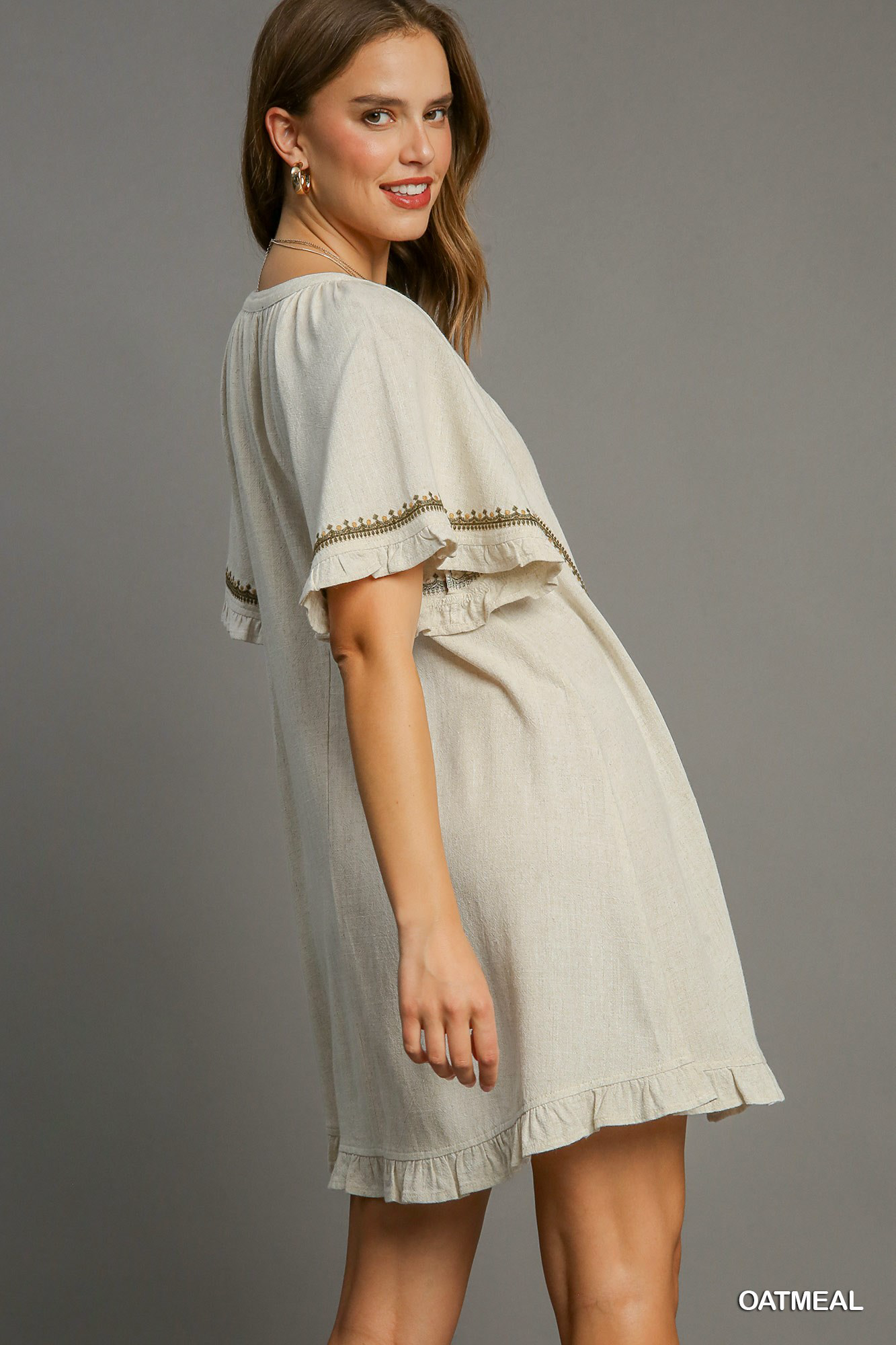 Linen peasant mini dress with ruffle trim, split neck and embroidery Dress Umgee