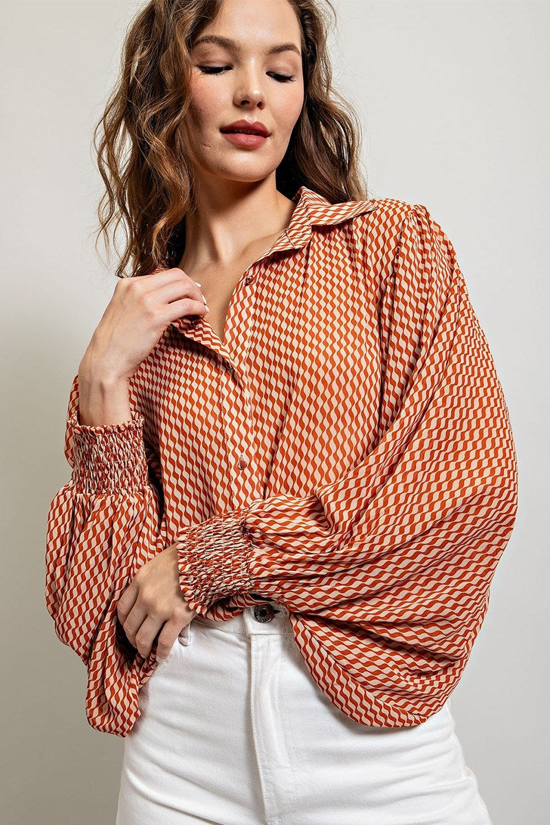 Printed blouse top with collared neckline, button down front, and smocked cuffs Blouse EE:Some