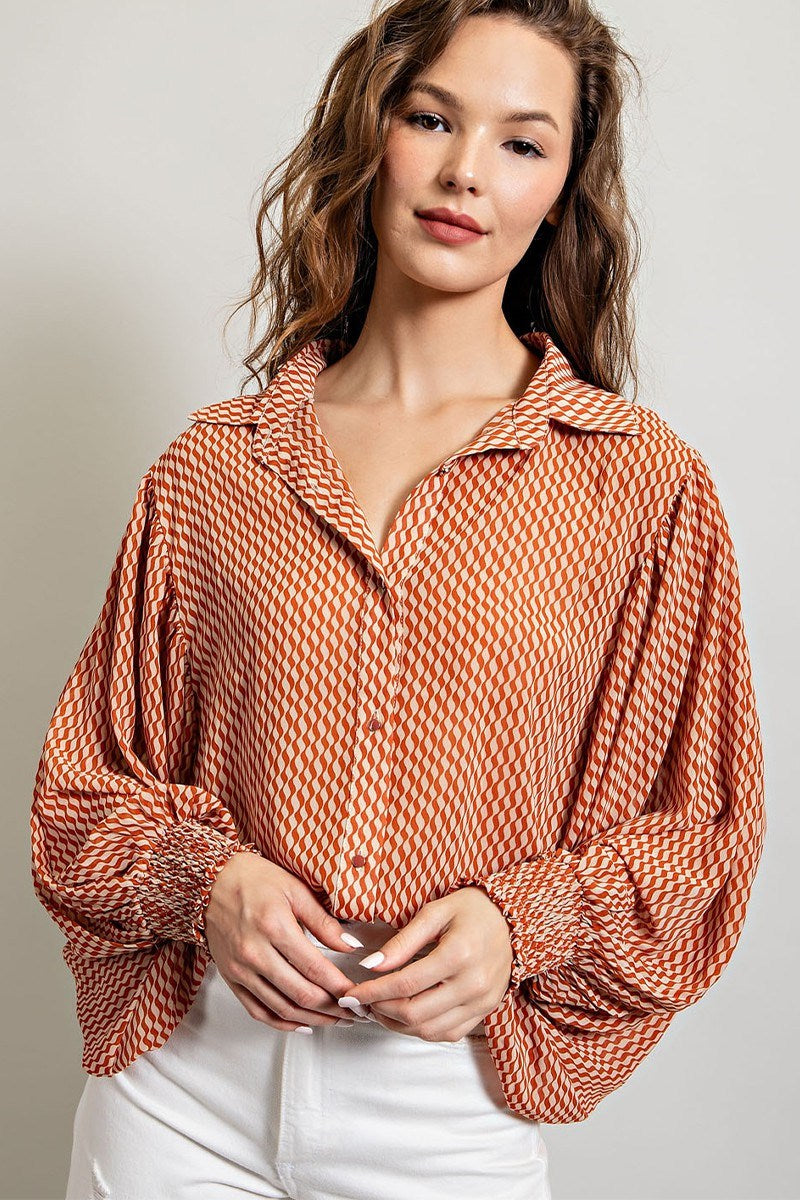 Printed blouse top with collared neckline, button down front, and smocked cuffs Blouse EE:Some