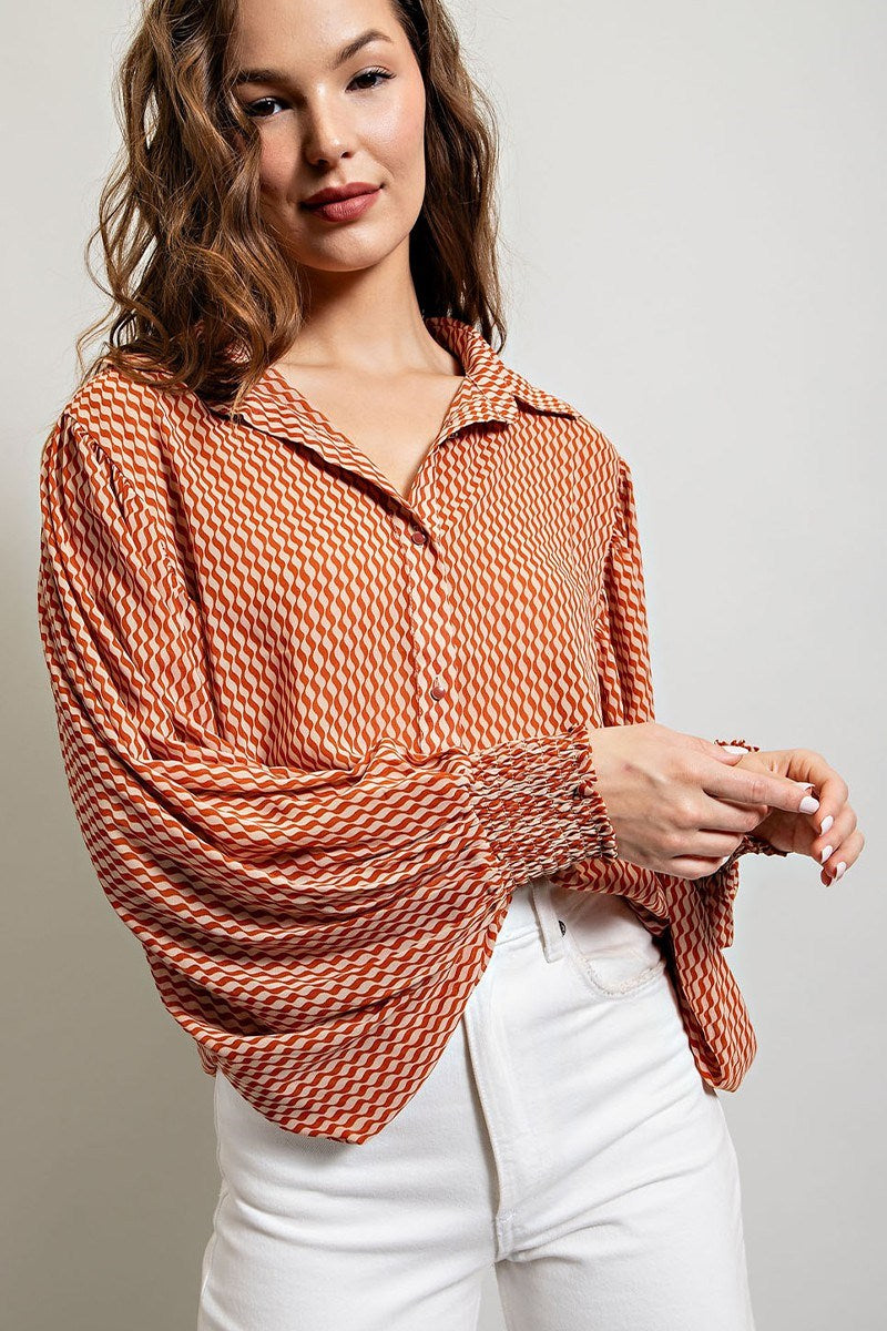 Printed blouse top with collared neckline, button down front, and smocked cuffs Blouse EE:Some