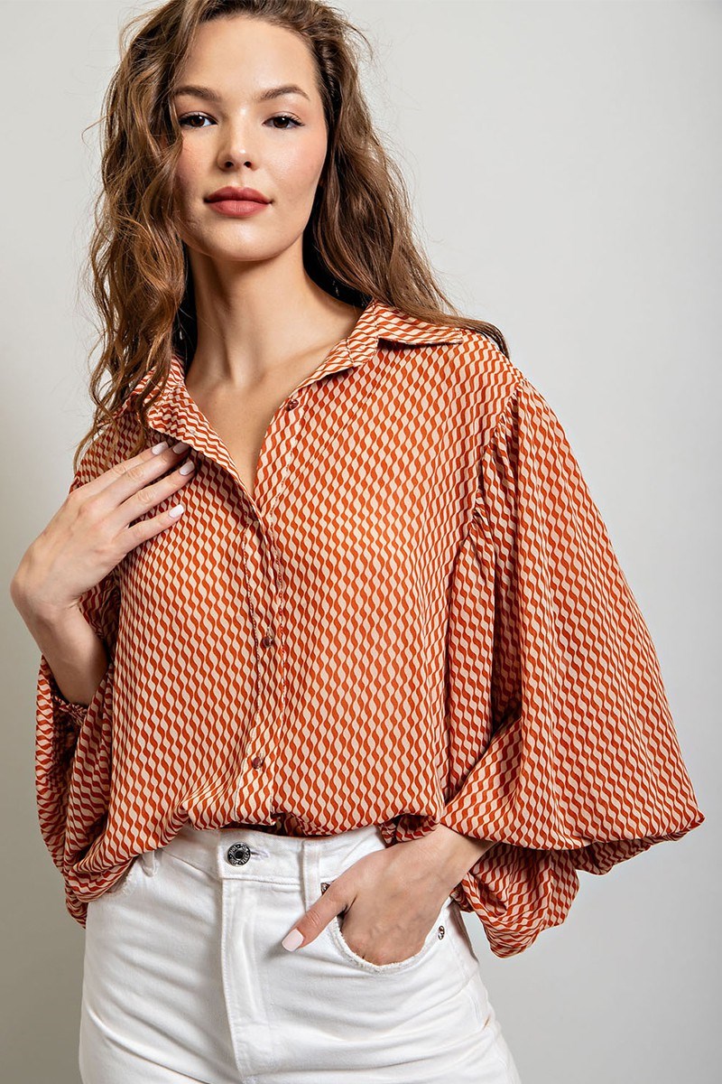 Printed blouse top with collared neckline, button down front, and smocked cuffs Blouse EE:Some