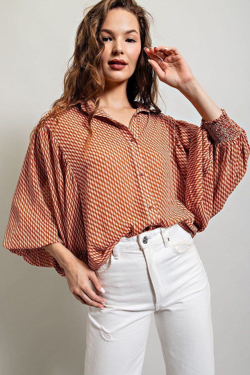 Printed blouse top with collared neckline, button down front, and smocked cuffs Blouse EE:Some