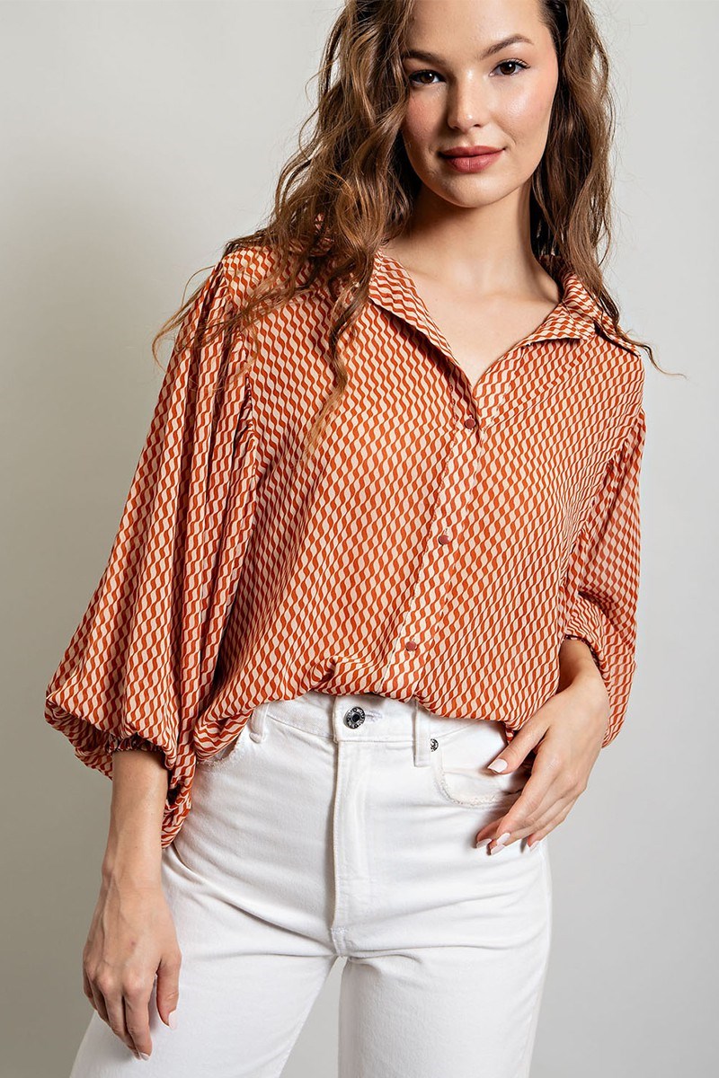 Printed blouse top with collared neckline, button down front, and smocked cuffs Blouse EE:Some