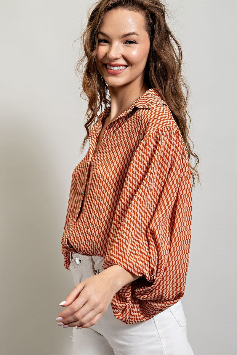 Printed blouse top with collared neckline, button down front, and smocked cuffs Blouse EE:Some