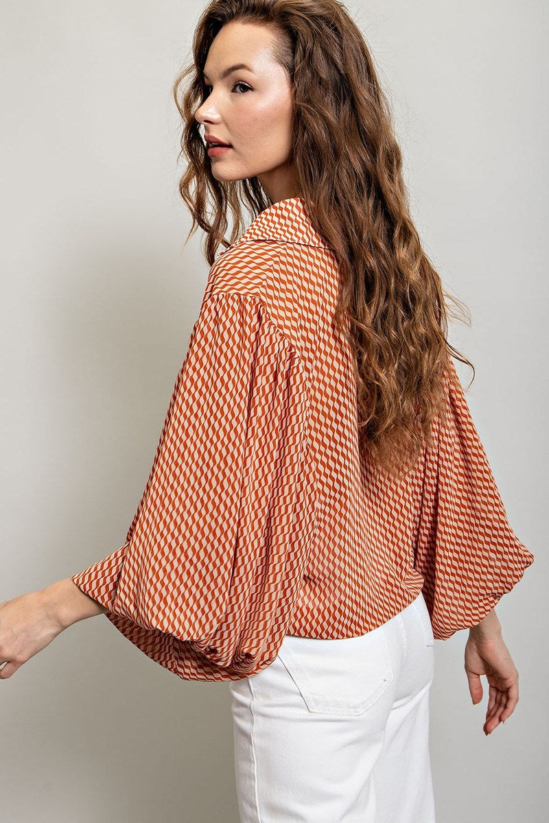 Printed blouse top with collared neckline, button down front, and smocked cuffs Blouse EE:Some