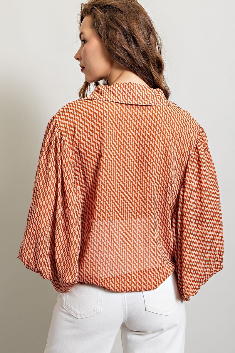 Printed blouse top with collared neckline, button down front, and smocked cuffs Blouse EE:Some