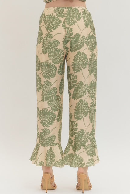 Botanical print wide leg pants featuring elasticated waistband with drawstring tie