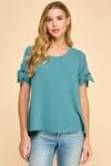 Solid top with knot detailed sleeves