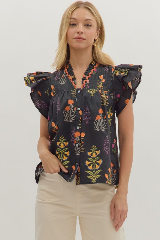 Botanical print short flutter sleeve top featuring pintuck bodice with embroidered trim V-neck