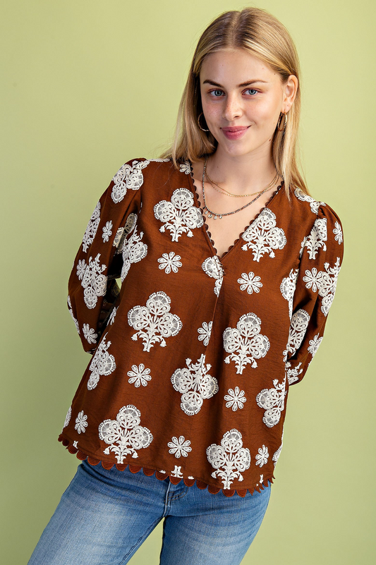 Puff printed v-neck blouse with 3/4 length sleeves and ric-rac trim