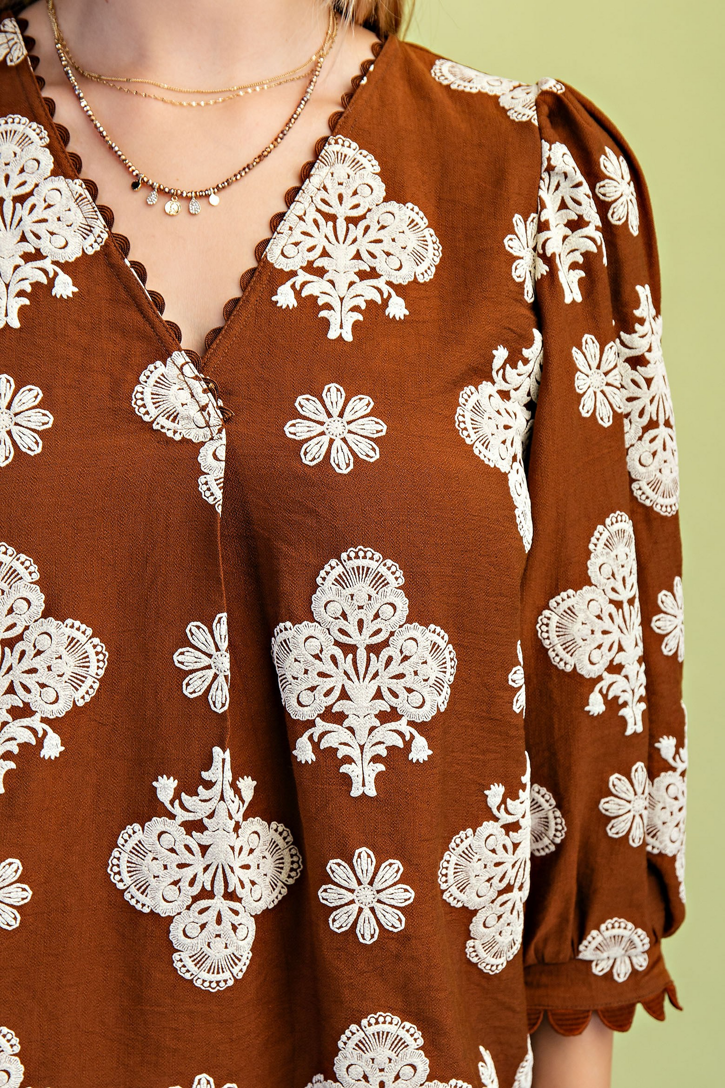 Puff printed v-neck blouse with 3/4 length sleeves and ric-rac trim