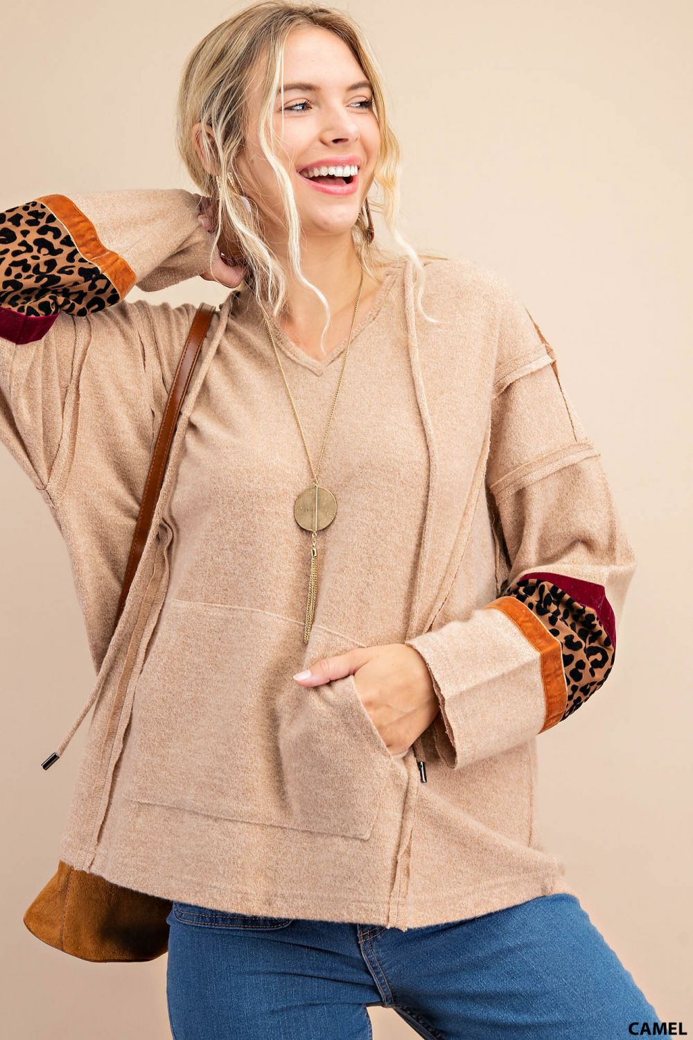 Distressed raw hem hoodie with animal print patch and front pockets Ivy and Pearl Boutique