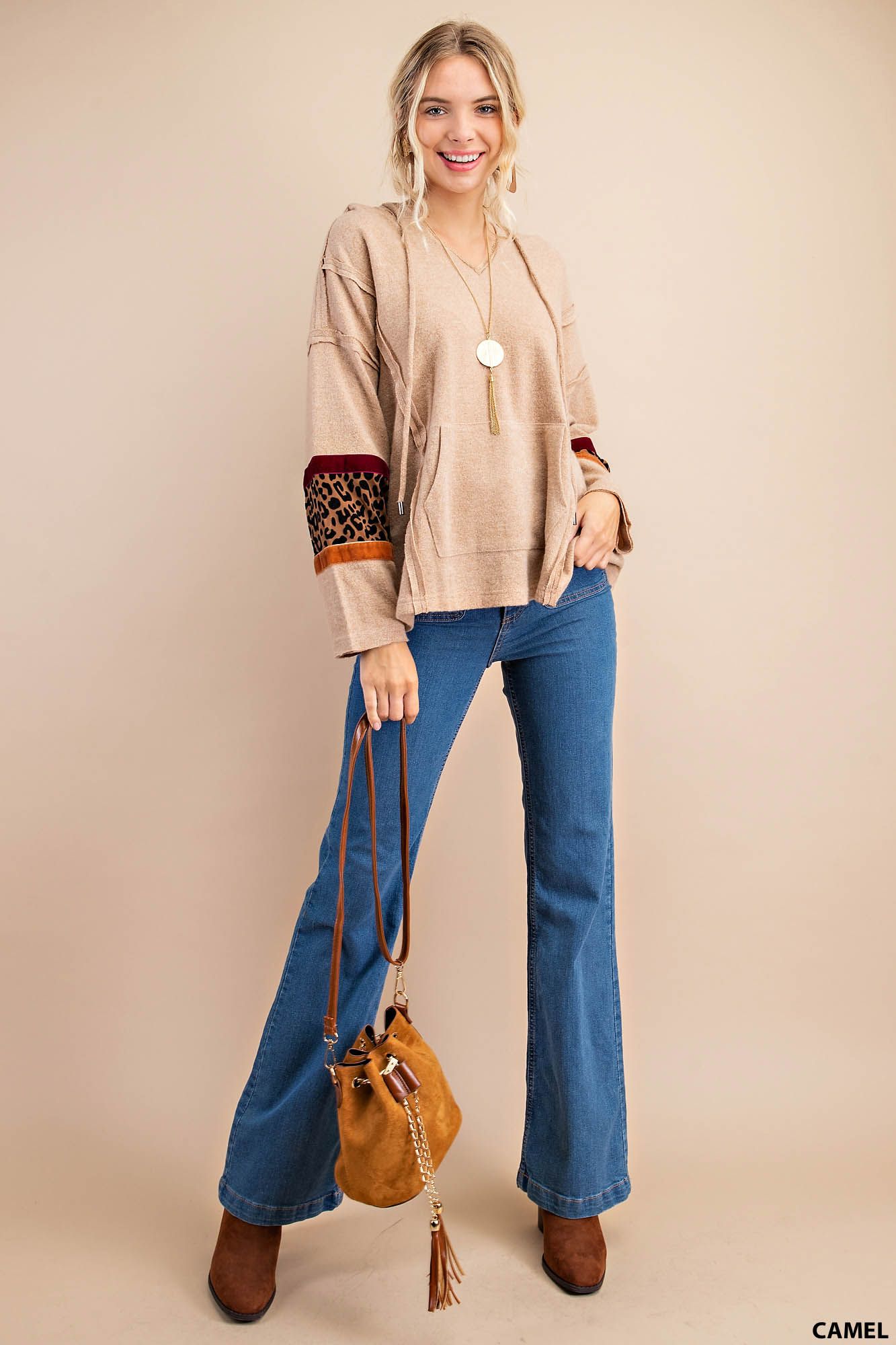 Distressed raw hem hoodie with animal print patch and front pockets Ivy and Pearl Boutique