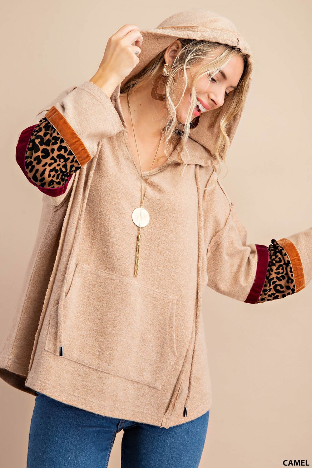 Distressed raw hem hoodie with animal print patch and front pockets Ivy and Pearl Boutique Carmel S
