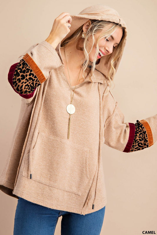 Distressed raw hem hoodie with animal print patch and front pockets  Ivy and Pearl Boutique Carmel S