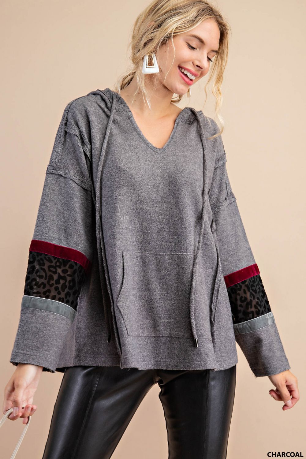 Distressed raw hem hoodie with animal print patch and front pockets Ivy and Pearl Boutique