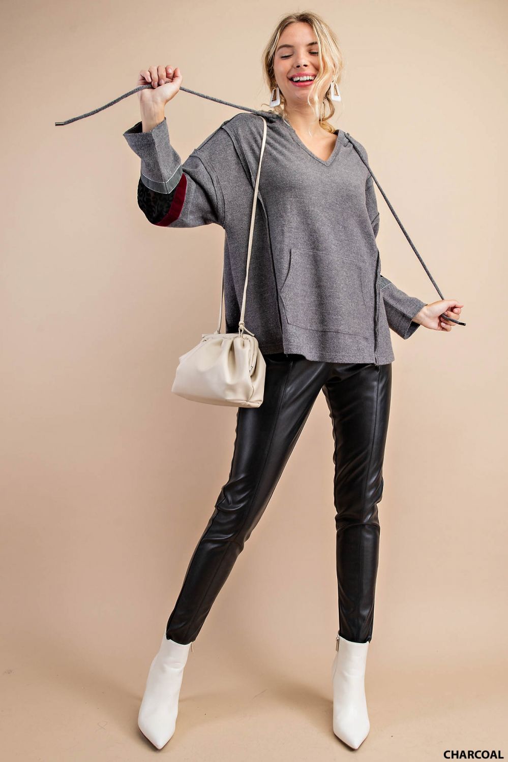 Distressed raw hem hoodie with animal print patch and front pockets Ivy and Pearl Boutique