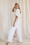 Gauze raw edge poncho top  Ivy and Pearl Boutique