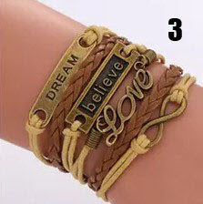 Handmade leather braided bracelet with variety of charms  Ivy and Pearl Boutique