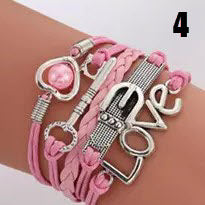 Handmade leather braided bracelet with variety of charms  Ivy and Pearl Boutique