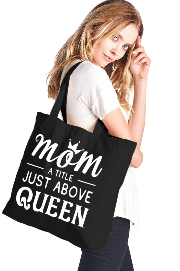 Mom a title just above queen cotton canvas tote bag Ivy and Pearl Boutique Black