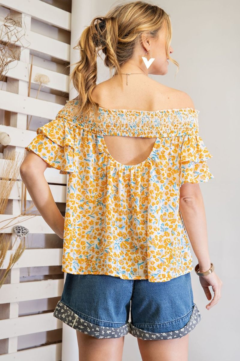Off shoulder loose fit top with ruffled sleeves and smocked neckline Ivy and Pearl Boutique