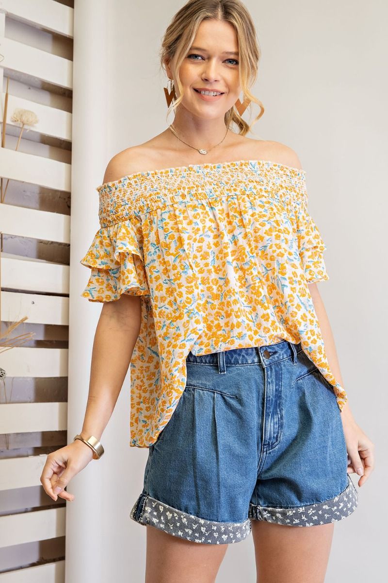 Off shoulder loose fit top with ruffled sleeves and smocked neckline Ivy and Pearl Boutique