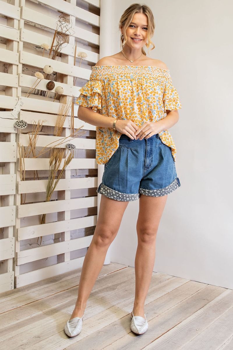 Off shoulder loose fit top with ruffled sleeves and smocked neckline Ivy and Pearl Boutique