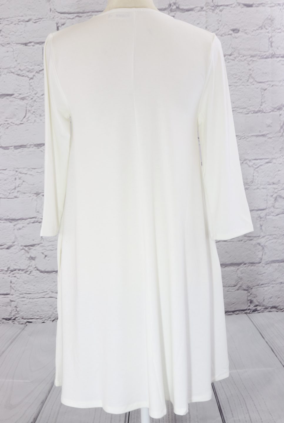 Three quarter sleeve swing tunic with side pockets Ivy and Pearl Boutique
