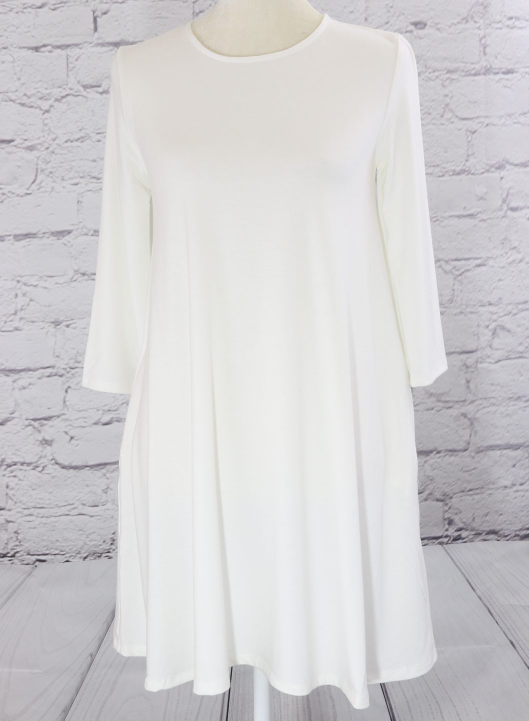 Three quarter sleeve swing tunic with side pockets Ivy and Pearl Boutique