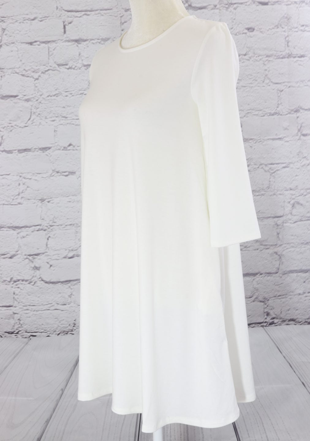 Three quarter sleeve swing tunic with side pockets Ivy and Pearl Boutique