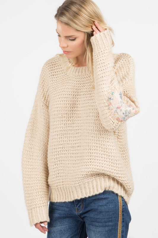 Basic ribbed pullover sweater with multi-colored floral elbow patch Ivy and Pearl Boutique