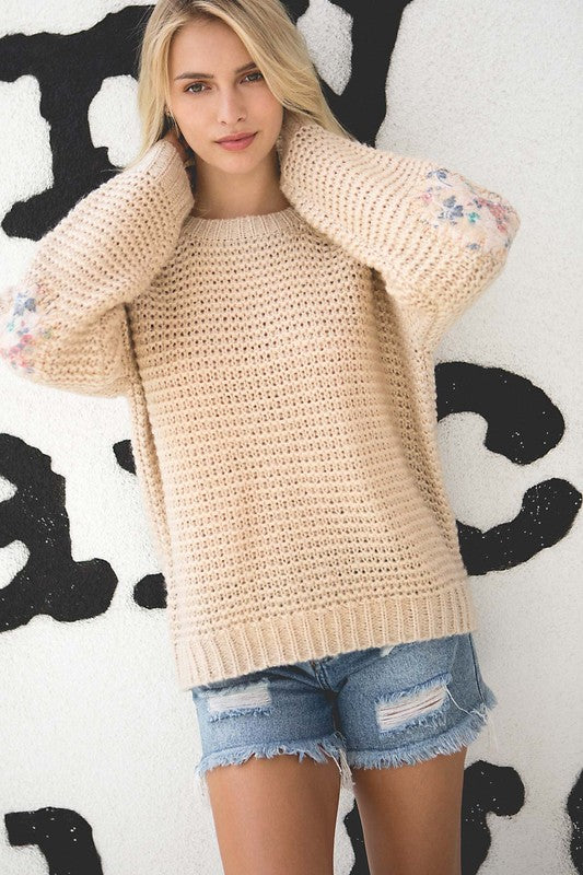 Basic ribbed pullover sweater with multi-colored floral elbow patch Ivy and Pearl Boutique