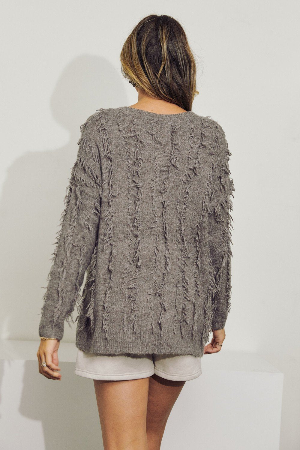 V-Neck long sleeve wool sweater top with fringe Ivy and Pearl Boutique