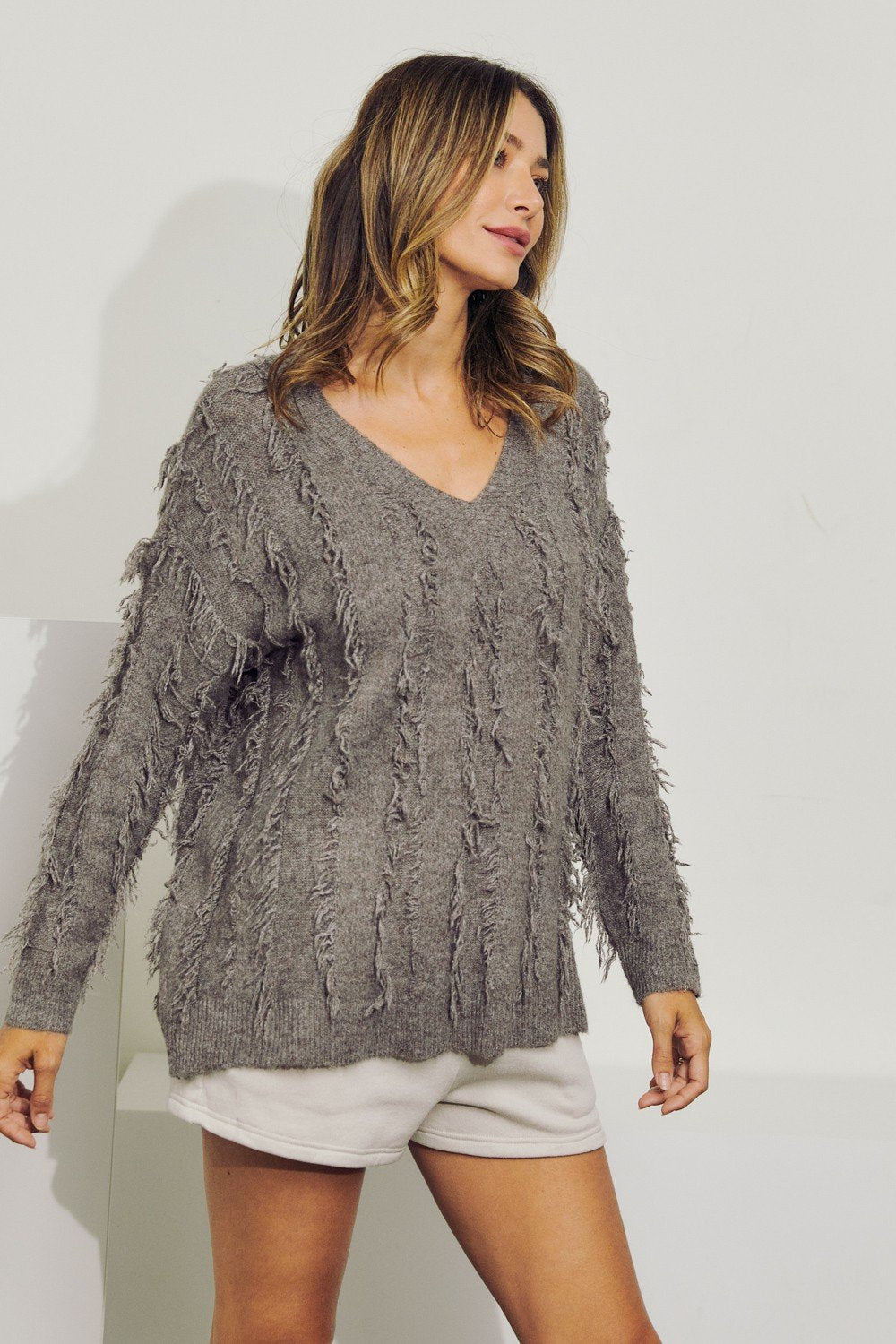 V-Neck long sleeve wool sweater top with fringe Ivy and Pearl Boutique