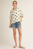 Drop shoulder polka dot satin top with collared neckline.