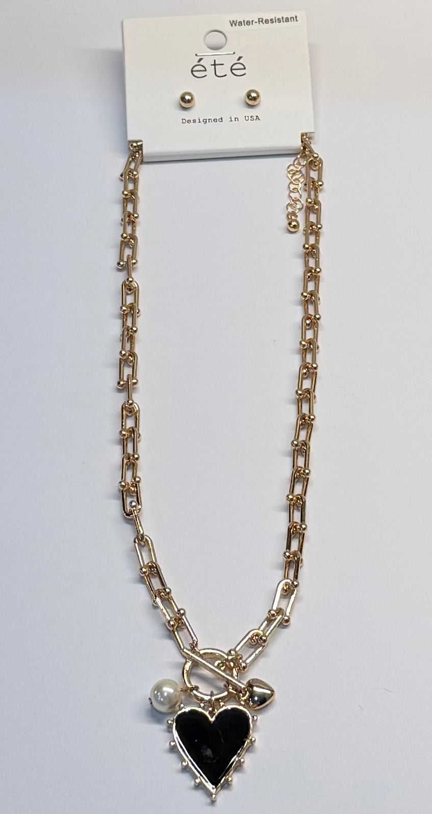 Gold hoop with gold and black heart necklace and gold bead earrings set