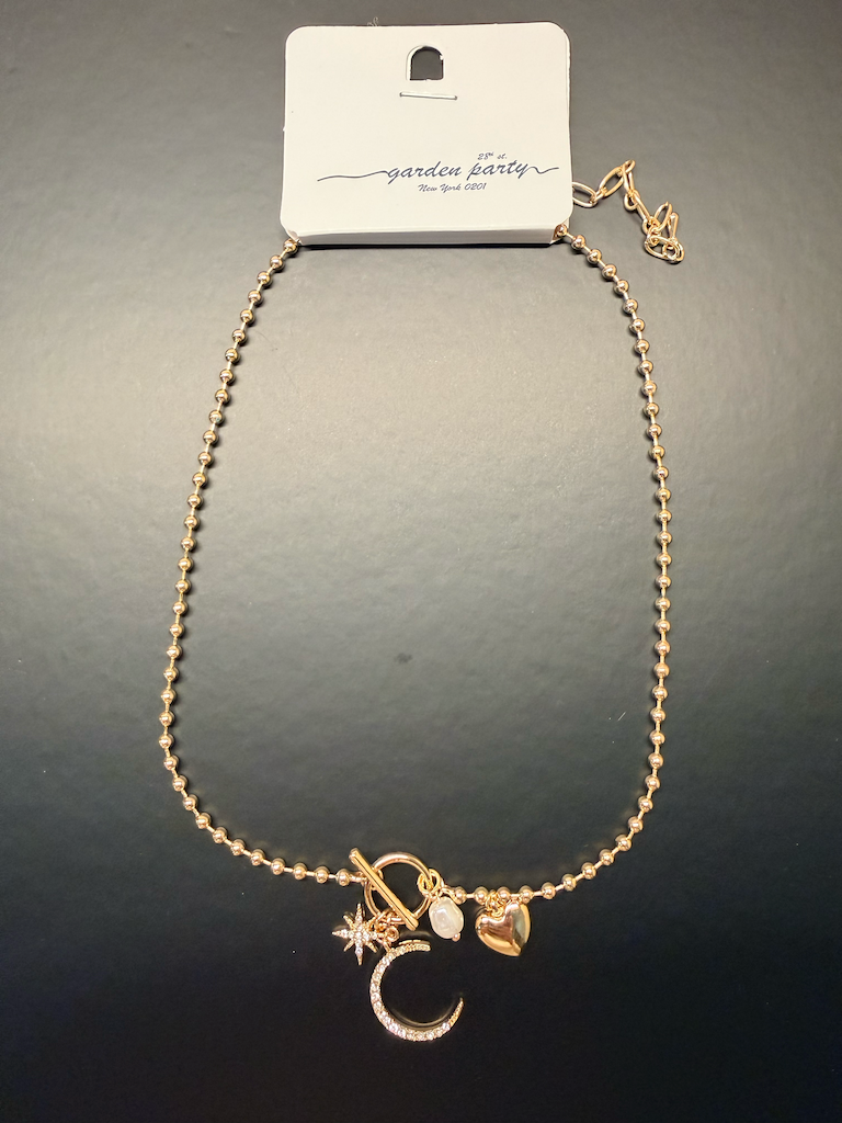 Moons, stars, heart, and pearl necklace