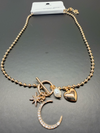 Moons, stars, heart, and pearl necklace