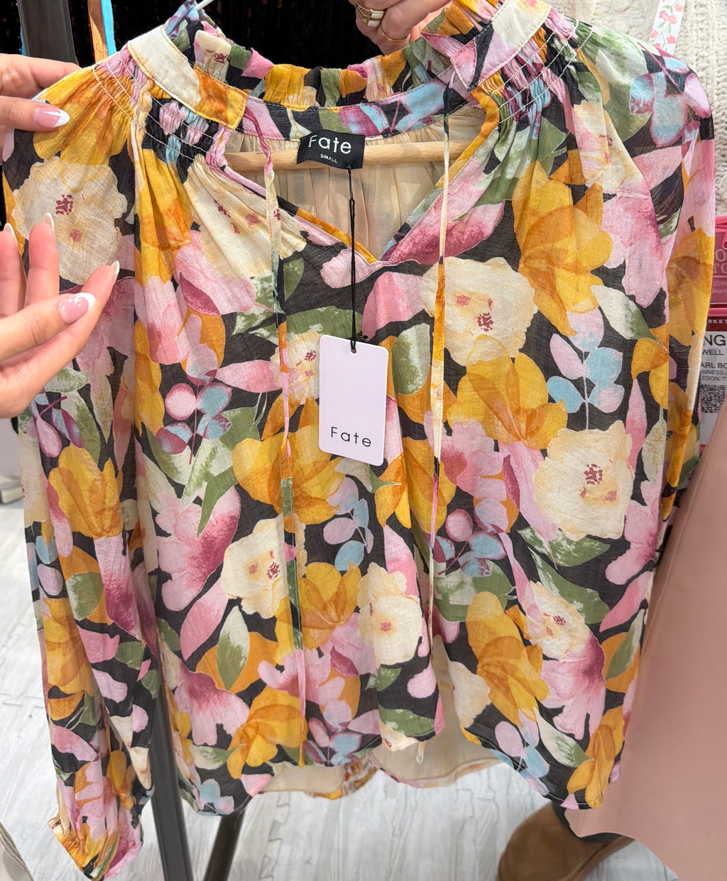 Bold floral print ruffled high neckline with tie detail