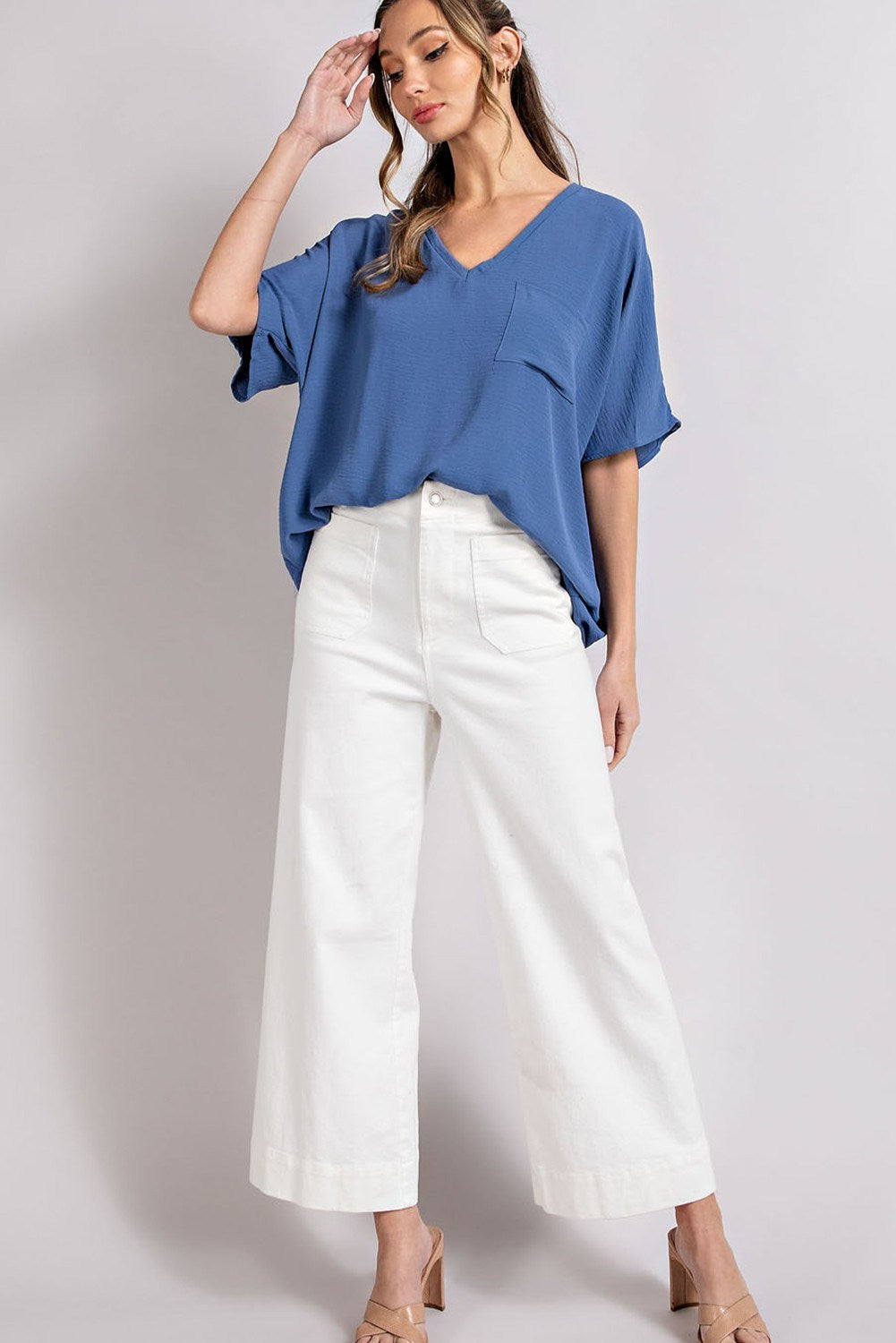 Woven top with V-neckline short sleeves and chest pocket